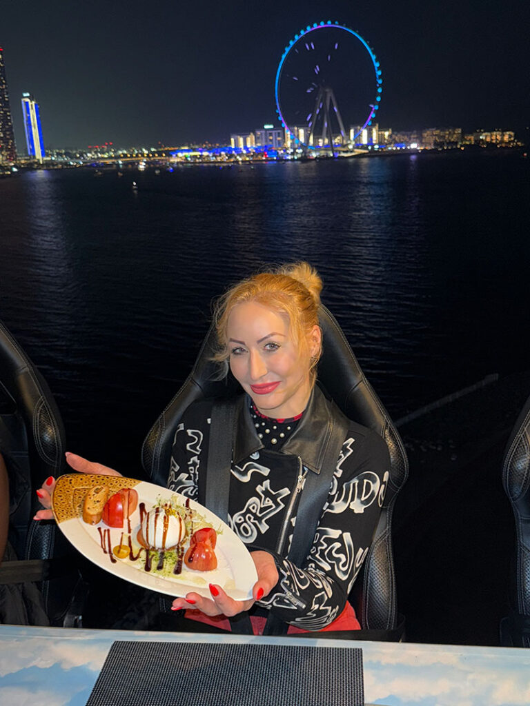 Sky Dinner in Dubai Sky Dinner in Dubai with a Ferris wheel in the background.