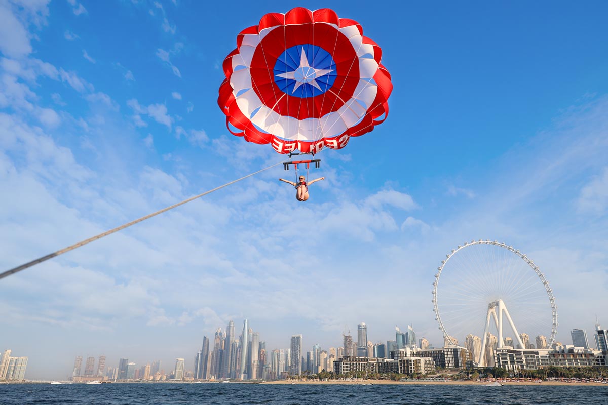 Parasailing in Dubai, with the skyline in the background.